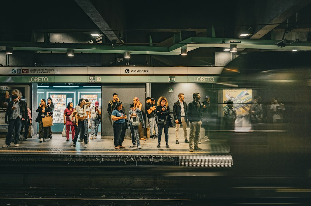 Crowded subway station platform with commuters