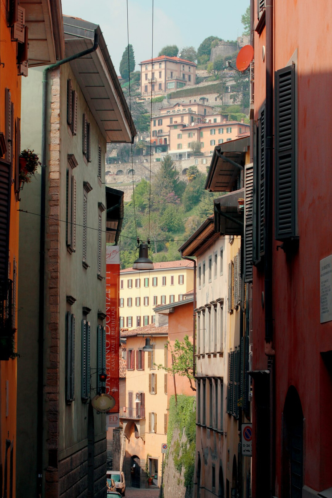 Colorful narrow alley with painted houses in a hillside city